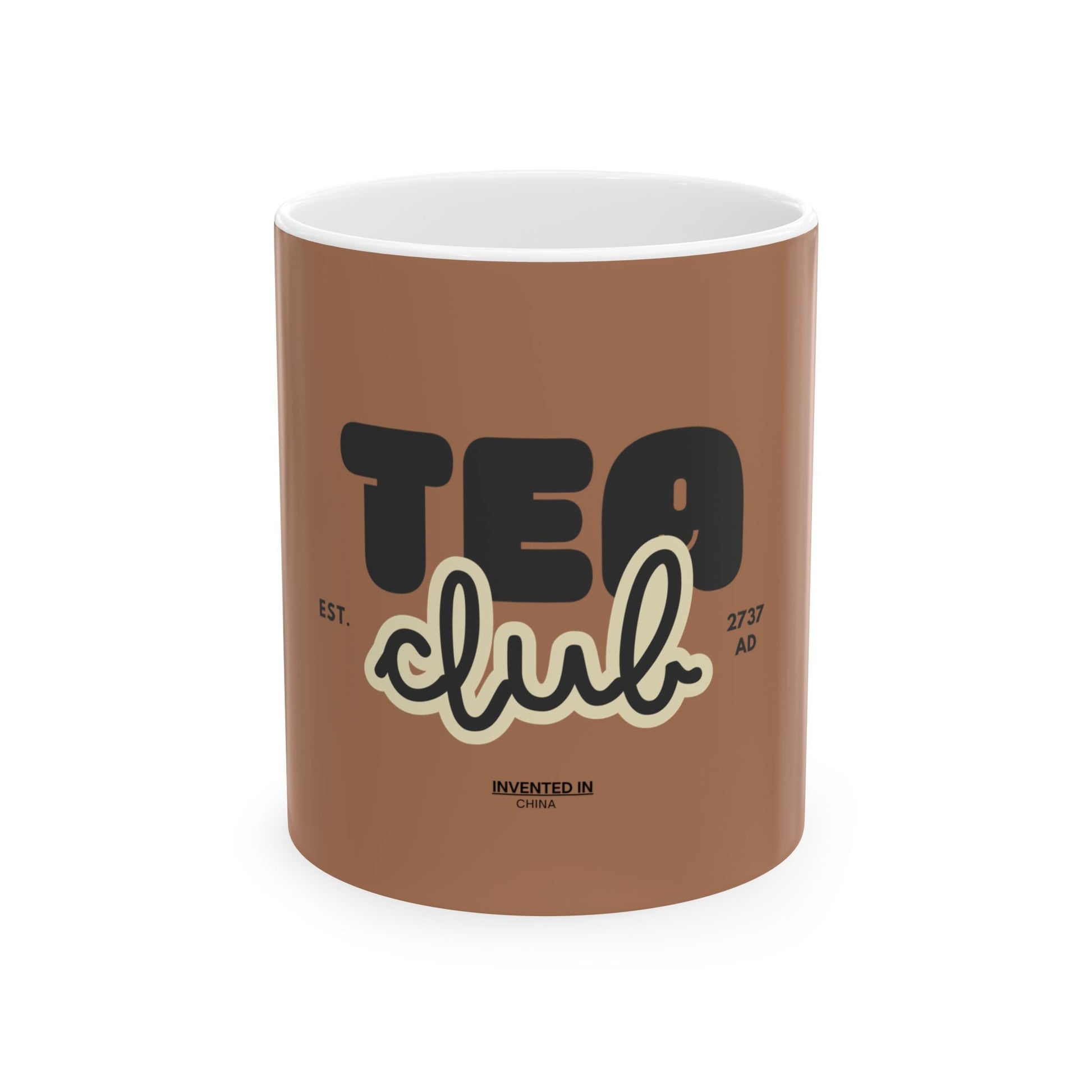 A brown ceramic mug with a white interior, featuring a graphic design that reads 'TEA club' in black and cream lettering, with 'EST. 2757 AD' and 'INVENTED IN CHINA' printed below.