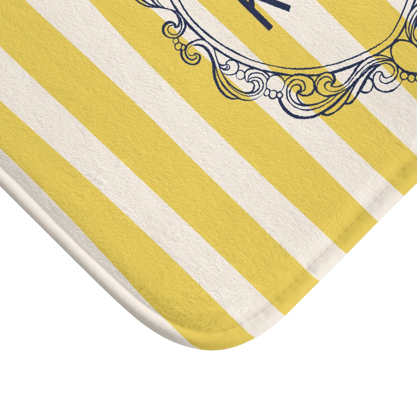Yellow and white striped rug with decorative border on a white background