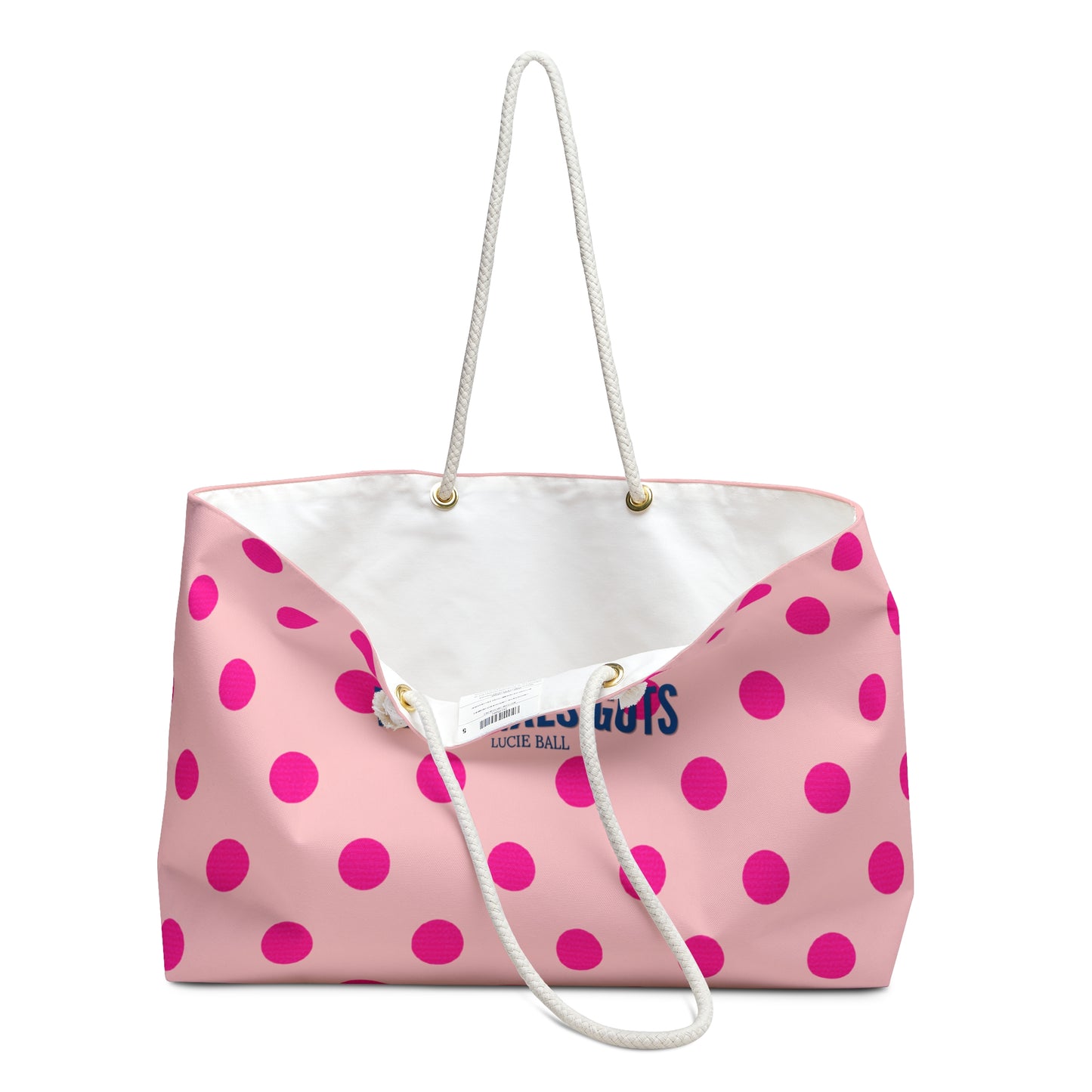 Pink tote bag with white handle and pink polka dots on a white background