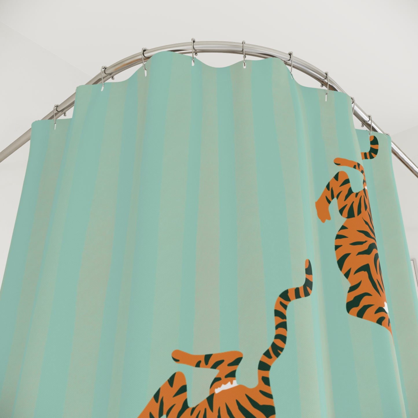 Shower curtain with tiger design on a teal background