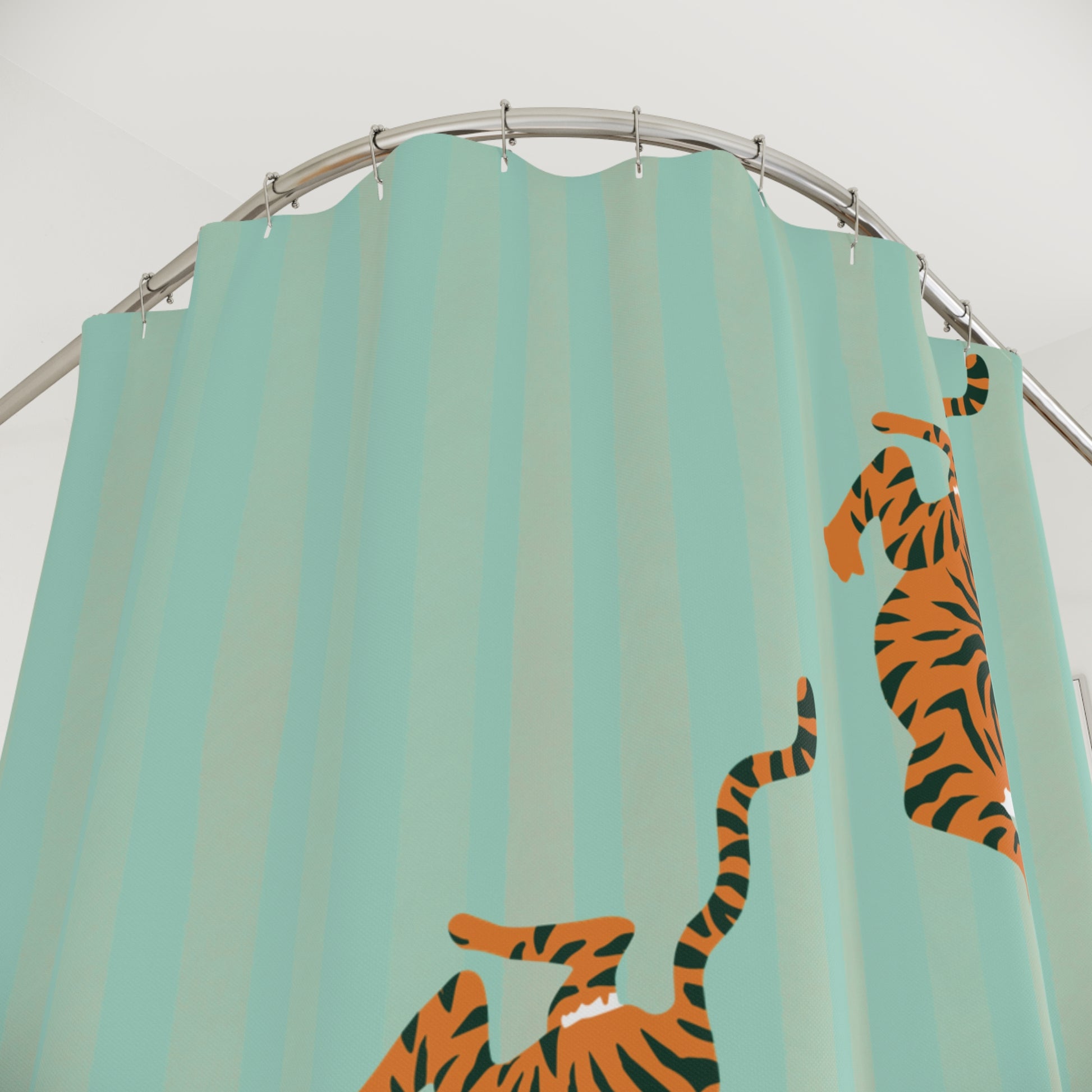 Shower curtain with tiger design on a teal background
