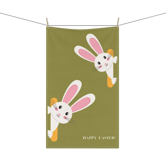 Green towel with cartoon bunnies and 'Happy Easter!' text hanging on a line.