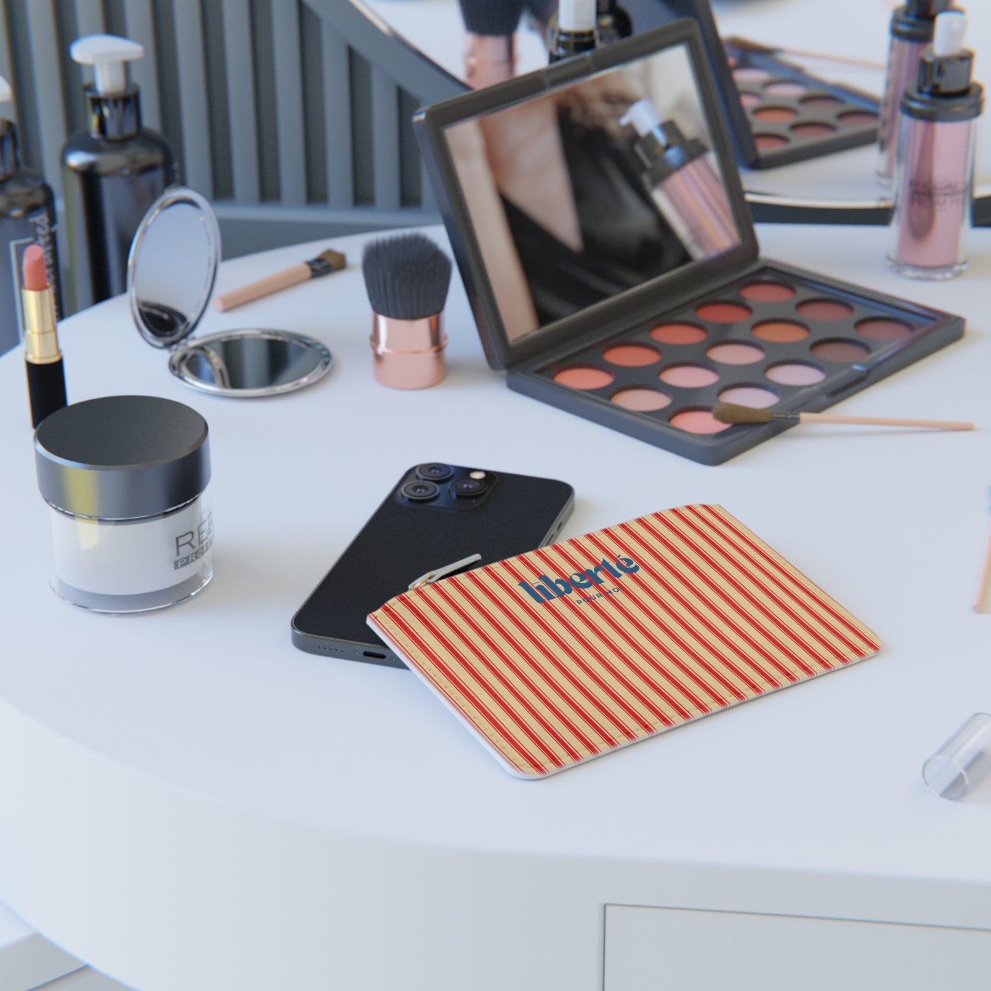 Makeup products and tools on a table with a striped mat featuring 'liberty' branding.