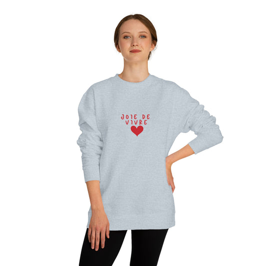 Person wearing a light gray sweatshirt with red text and heart design on a white background