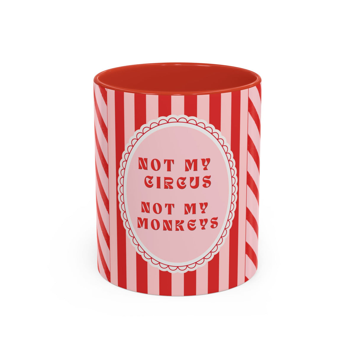 A red and white striped ceramic mug with a pink circular label in the center that reads 'NOT MY CIRCUS NOT MY MONKEYS' in red text.