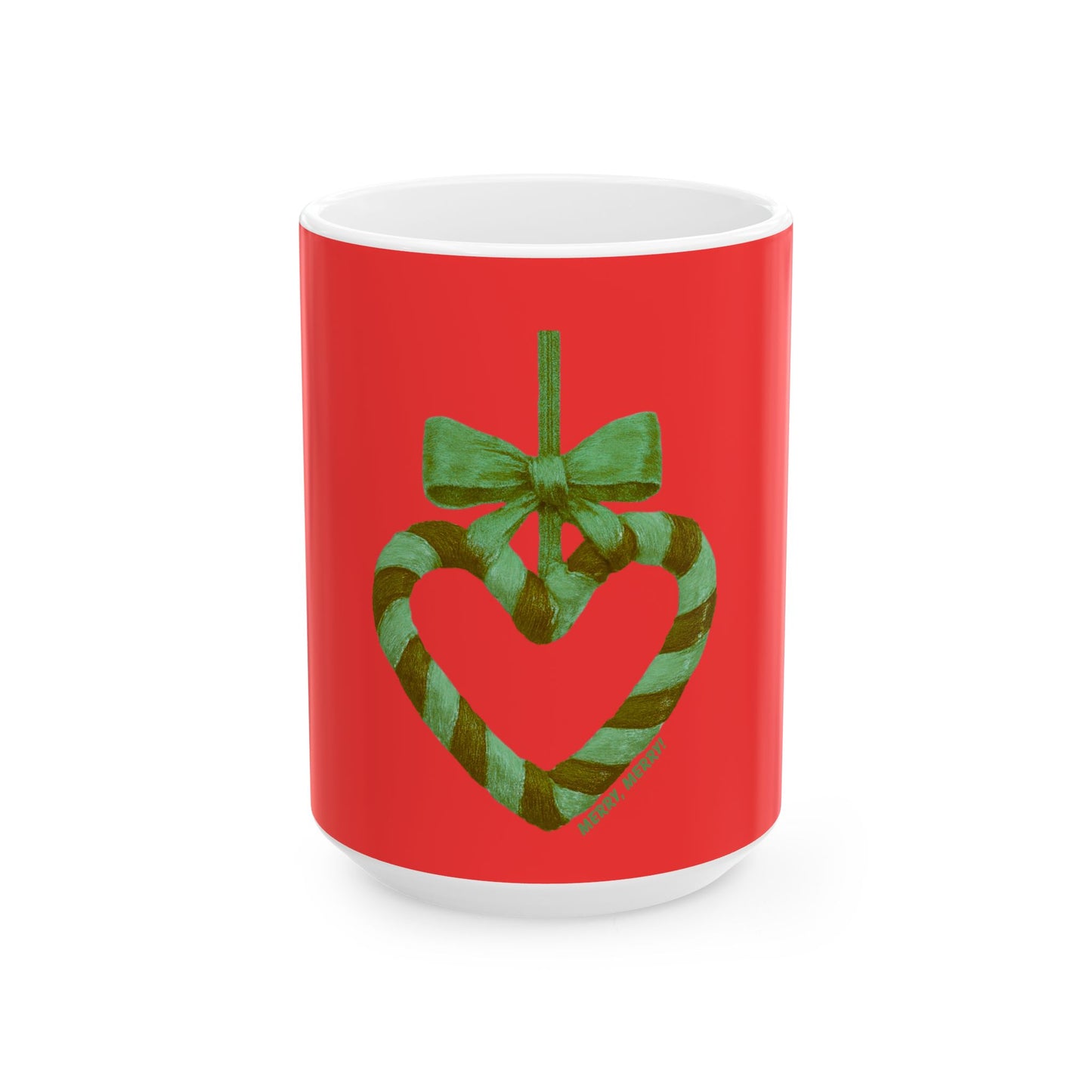 Red mug with a green heart and bow design on a white background