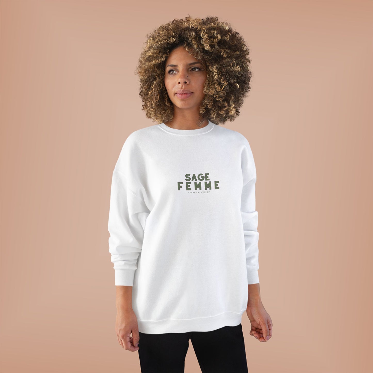 Woman wearing a white sweatshirt with 'SAGE FEMME' text on a beige background