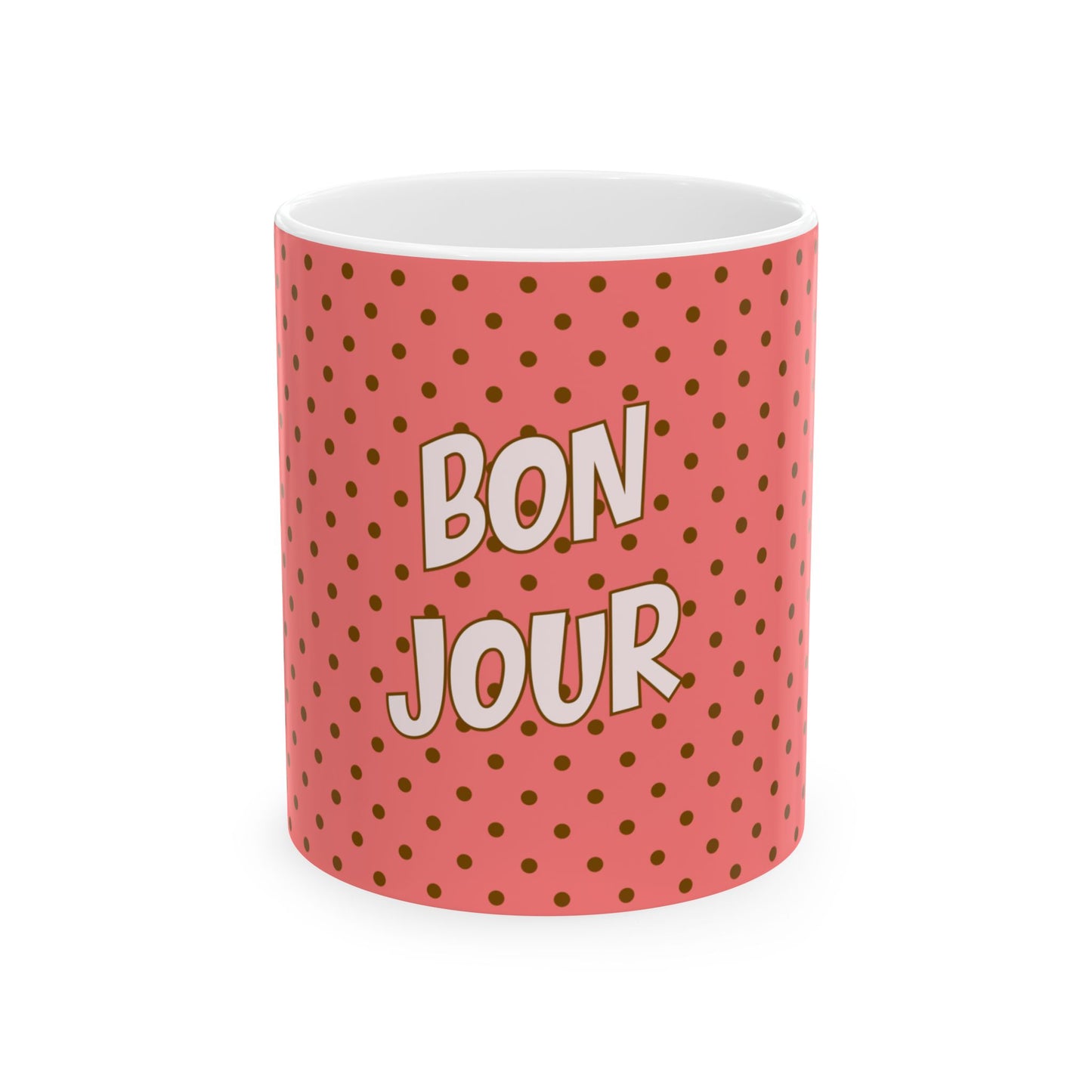 Mug with 'Bonjour' text on a pink polka dot background