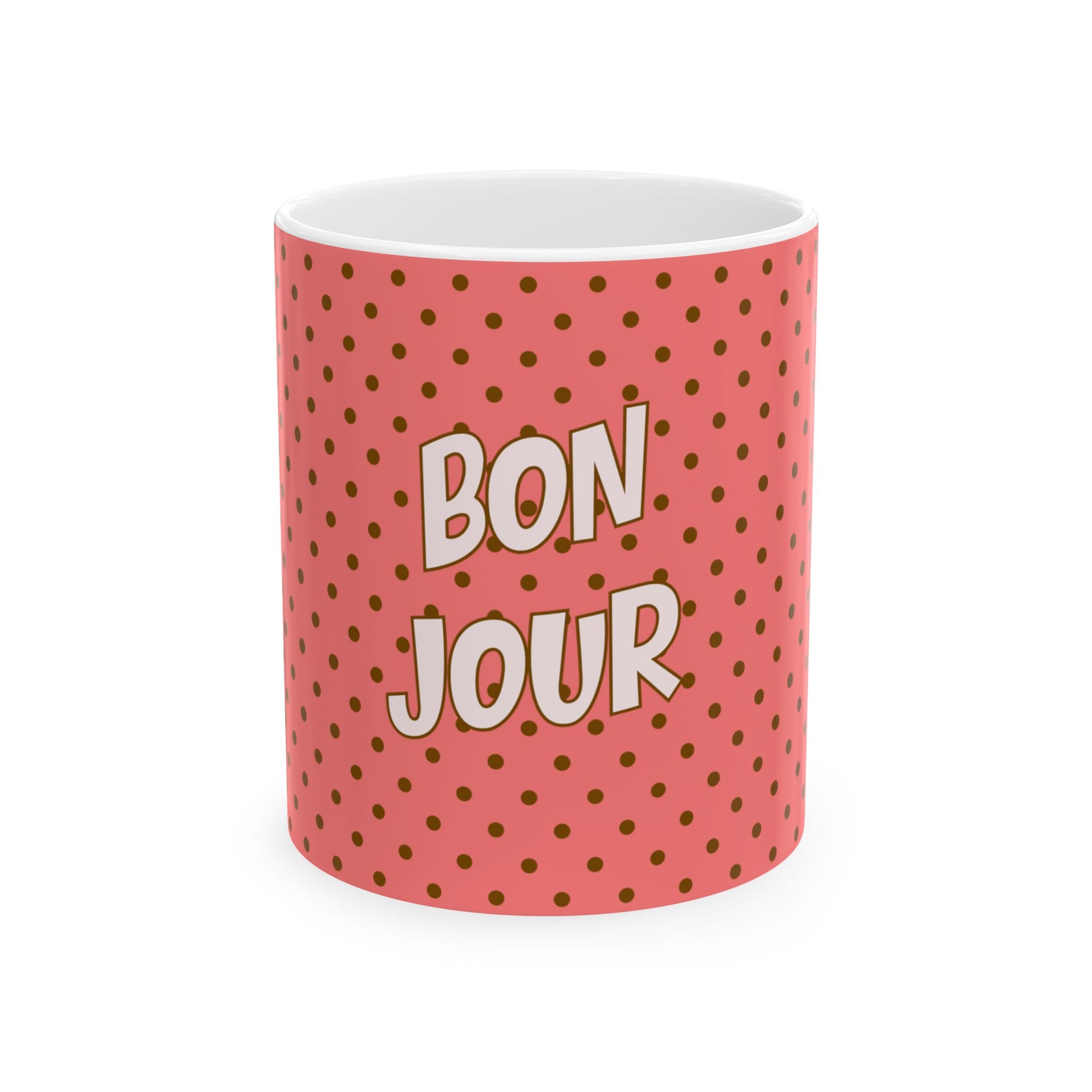 Mug with 'Bonjour' text on a pink polka dot background