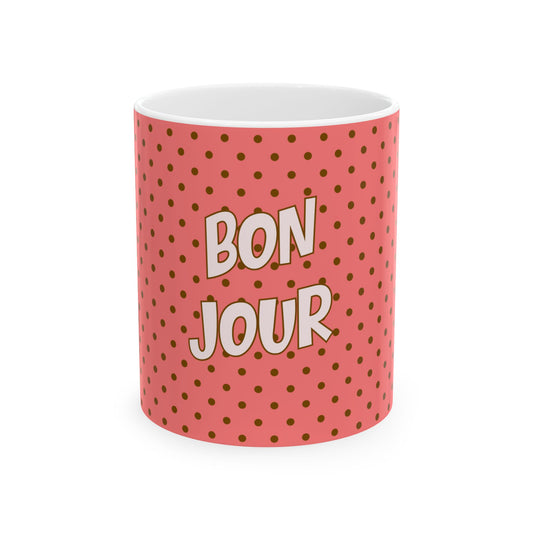 Mug with 'Bonjour' text on a pink polka dot background
