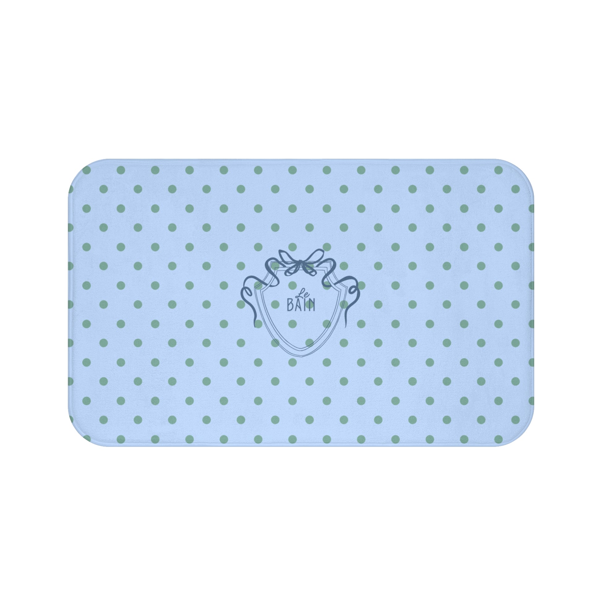 Light blue bath mat with green polka dots and a logo on a white background