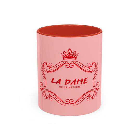 Pink mug with red interior and 'La Dame de la Maison' text on a white background