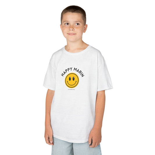 Child wearing a white t-shirt with a yellow smiley face and text on a white background