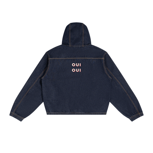 A dark navy blue hooded jacket shown from the back, featuring the word 'OUI' printed in a light pinkish-orange sans-serif font stacked vertically on the center back.