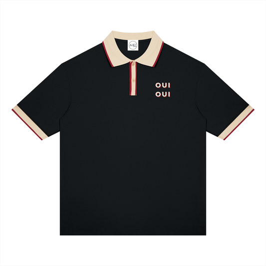 A black short-sleeve polo shirt with a beige collar and sleeve cuffs, accented by thin red stripes. The chest features the word 'OUI' printed in beige with red outlines on the left side.